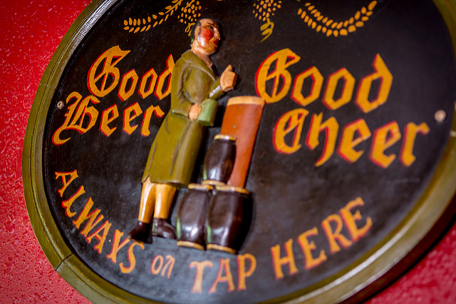 Carved wooden sign in the pub: Good Beer, Good Cheer — Always on Tap Here